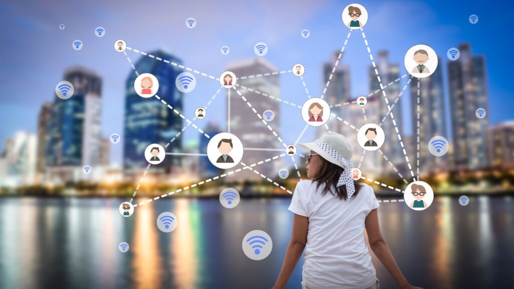 A child in a white shirt and hat faces a city skyline at dusk, with illustrated network connections and Wi-Fi symbols overlaid above the buildings—perfect as an animation for social media.