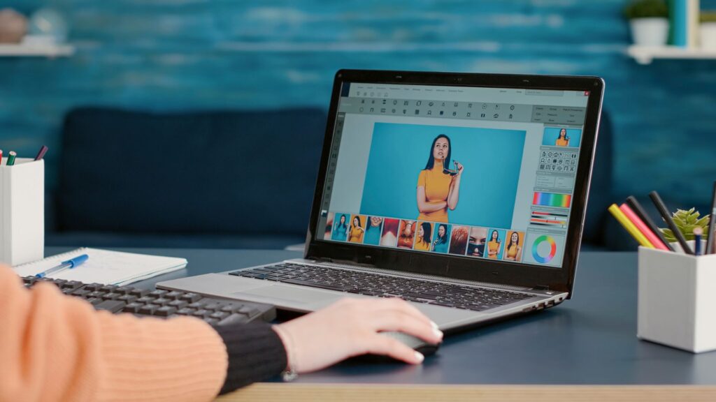 A person working intently on a laptop, focused on their Priority Animation Project.