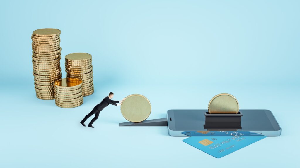 A miniature man pushes a large coin towards a smartphone with a credit card, with coin stacks in the background on a blue surface—perfect imagery for Banking Animation Videos.