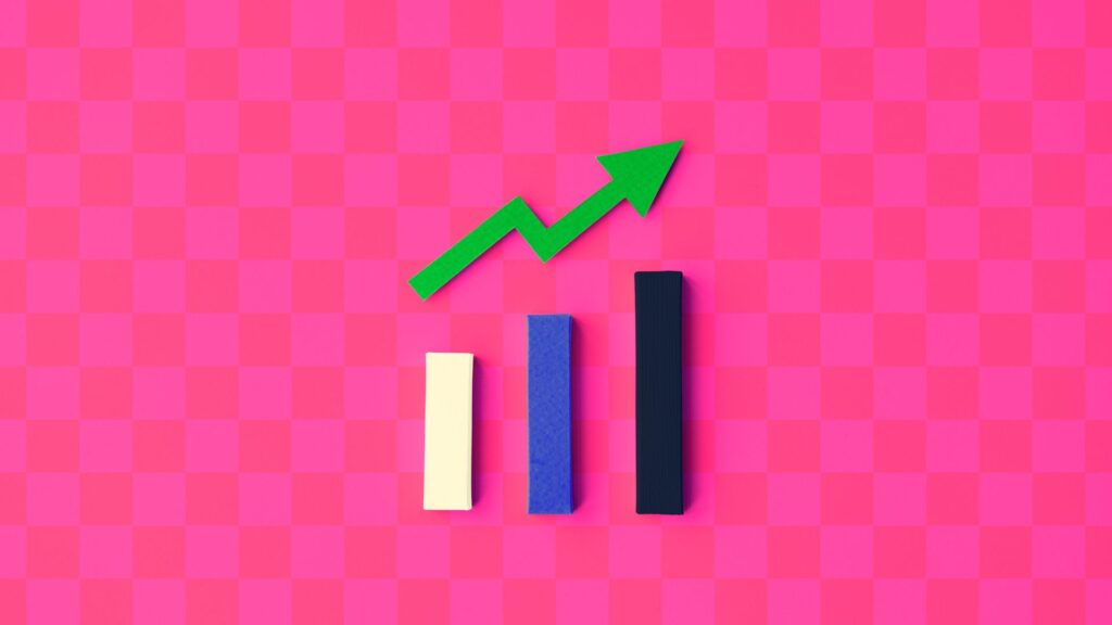 Three vertical bars of varying heights with a green upward arrow above them, set against a pink checkered background, illustrate growth or progress—perfect for an Investment Animation or visualizing Successful Investing strategies.