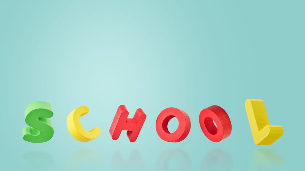 The word "SCHOOL" is spelled out in colorful, three-dimensional letters against a light blue background, reflecting the latest typography trends.